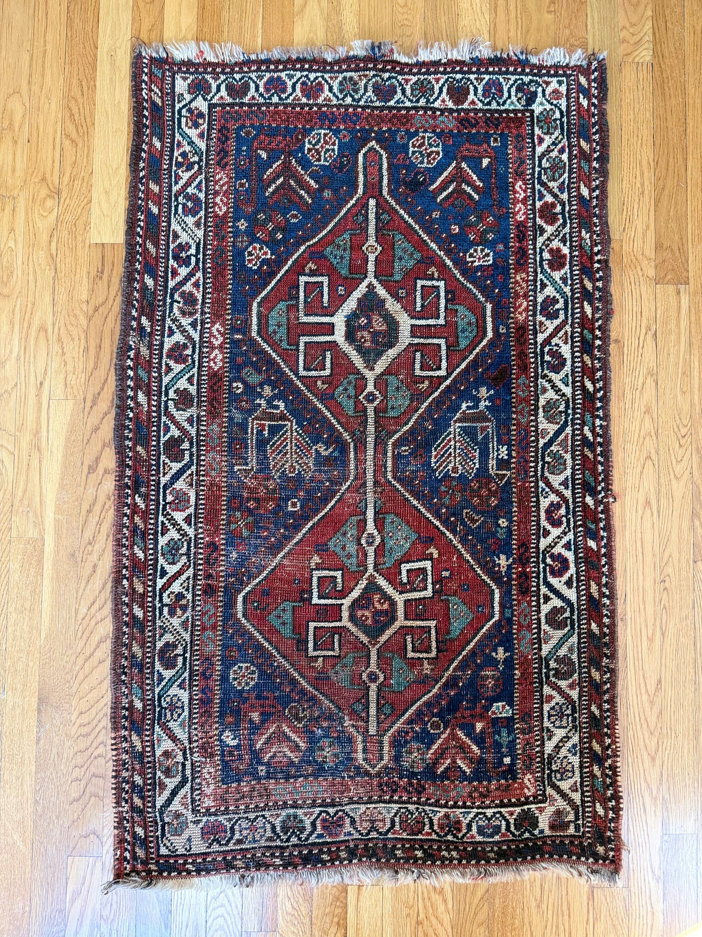 1006 | Striking Antique Caucasian Kuba in Deep Indigo Blue with Fiery Red Medallions & Colorful Tribal Borders | 2.9 x 4.6