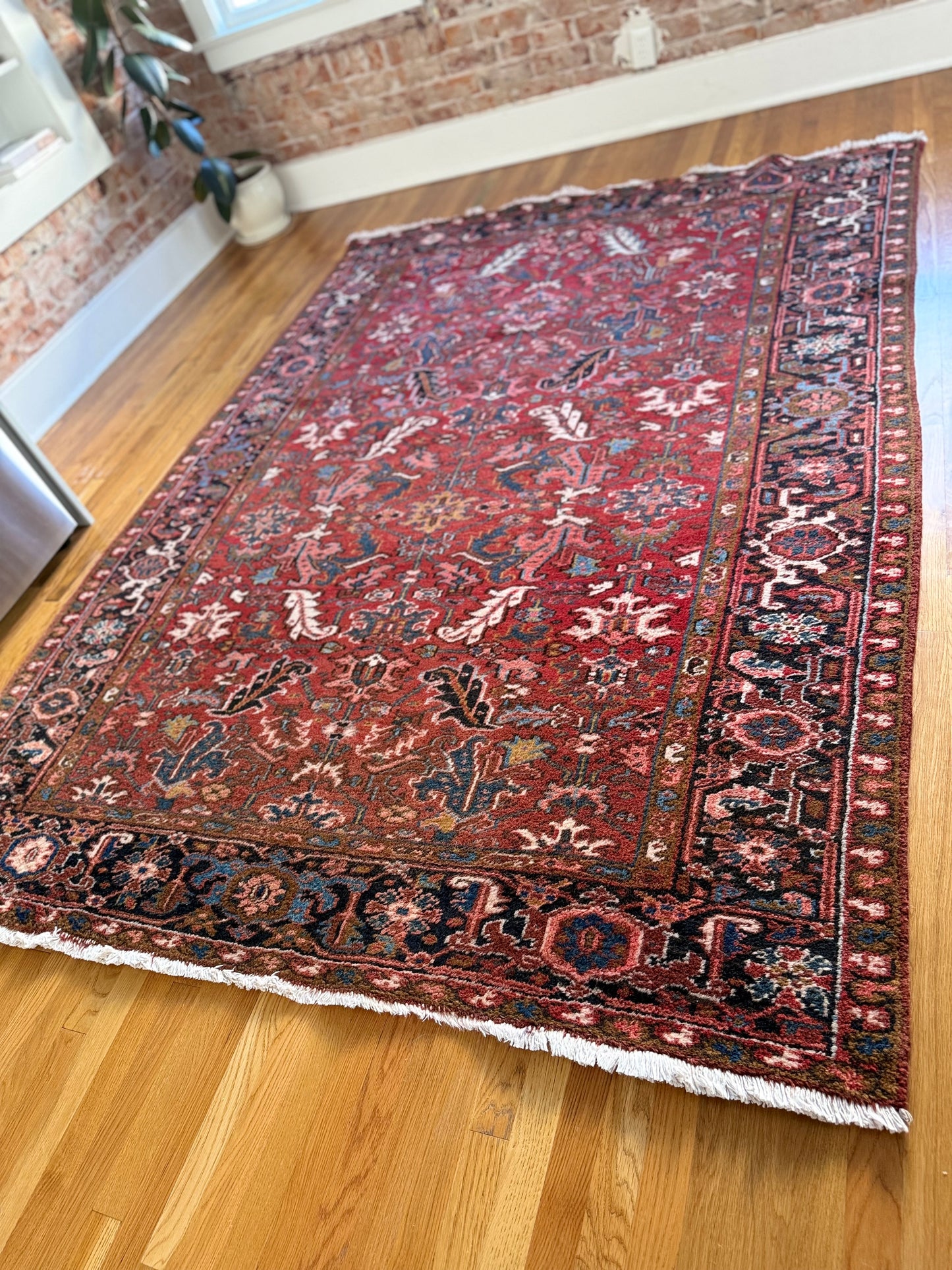 1060 | Unapologetic Antique Heriz Rug with Brick Red Field & Inky Border | 6.9 x 9.1